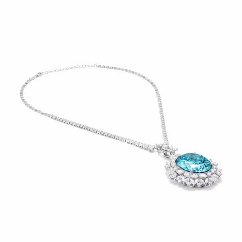 side view of Blue cubic zirconia halo necklace in silver