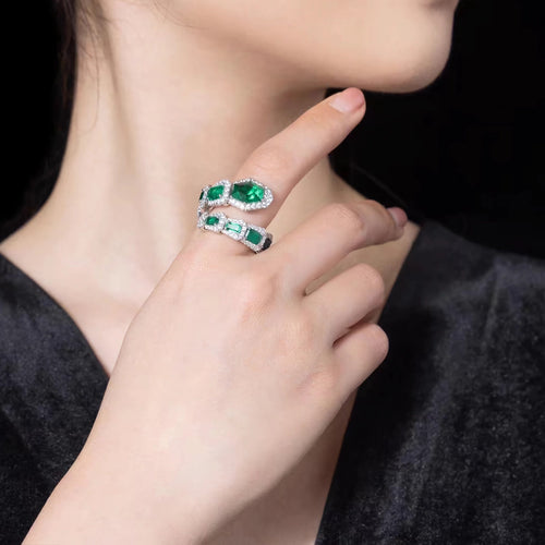 Green zircon ring in snake design