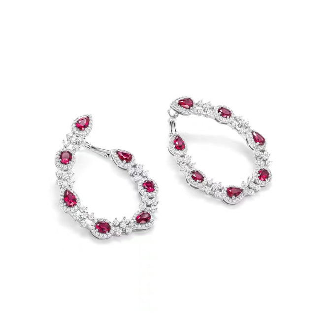 side view of Red cubic zirconia halo hoop earrings in silver