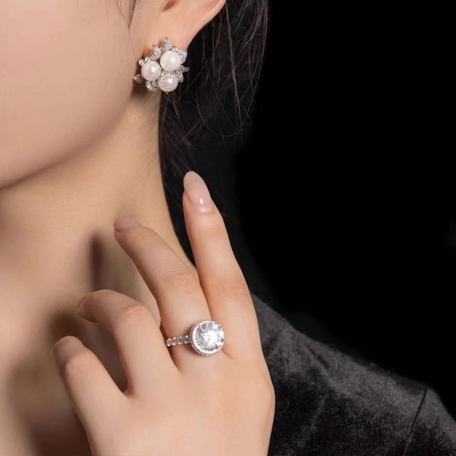 lady wearing Pearl silver earrings with moissanites 