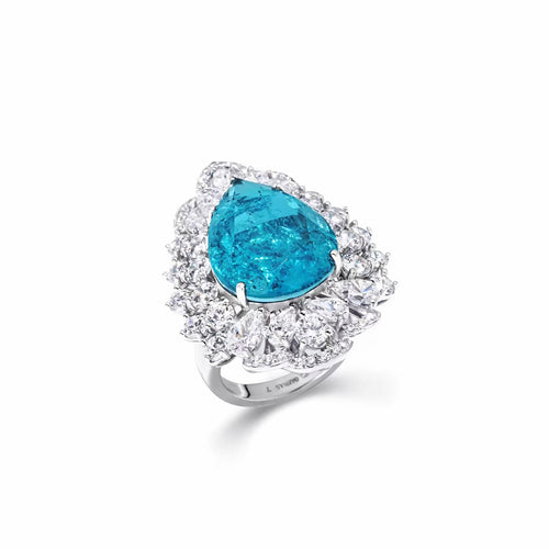 side view of Blue cubic zirconia halo engagement ring in silver