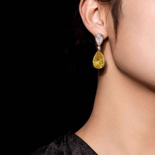 lady wearing Yellow pear zircon drop earrings