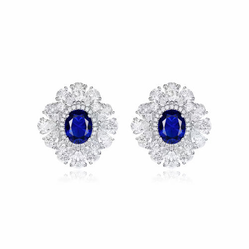 Front view of Blue sapphire silver earrings with moissanite halo