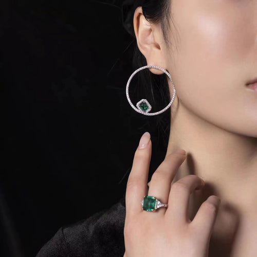 Emerald green hoop earrings with pavé