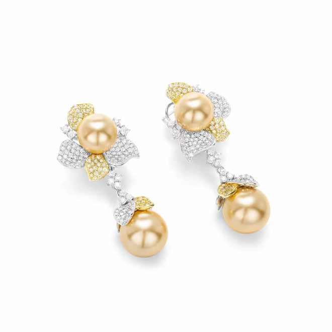 side view of Yellow pearl drop earrings in silver