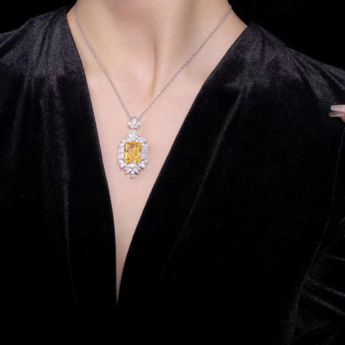 lady wearing Yellow radiant halo silver necklace 