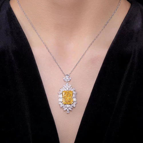 lady wearing Yellow radiant halo silver necklace 