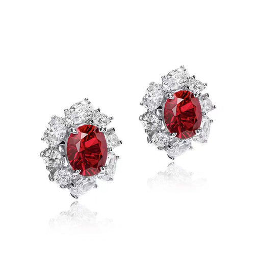 side view of Red oval zircon silver earrings with halo