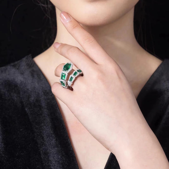 Green zircon ring in snake design