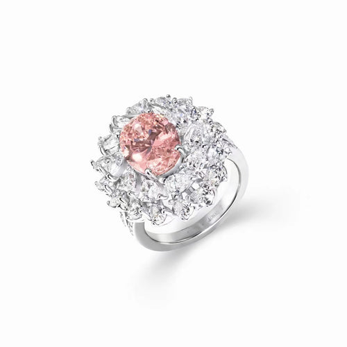 profile view of Oval pink zircon engagement ring with pear halo