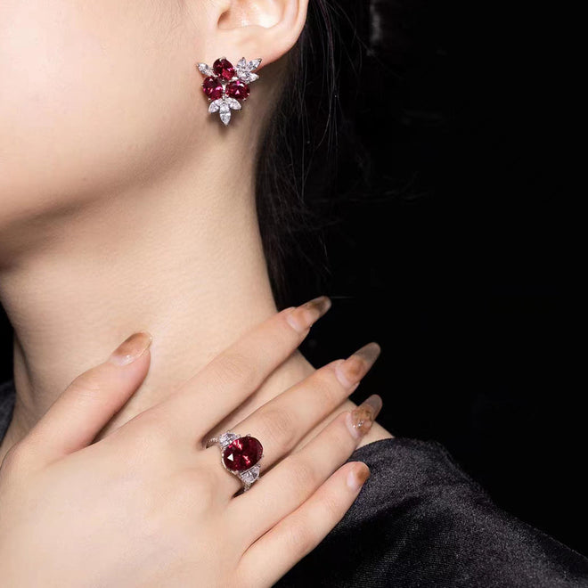 lady wearing Oval red zircon silver earrings with marquise accent