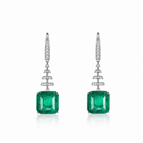 Dangling emerald drop earrings in silver