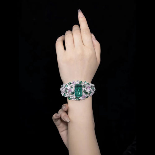 lady wearing Fancy emerald bangle with moissanites in silver 