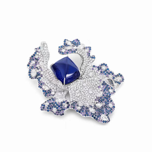 side view of Blue sapphire brooch with fancy color pavé