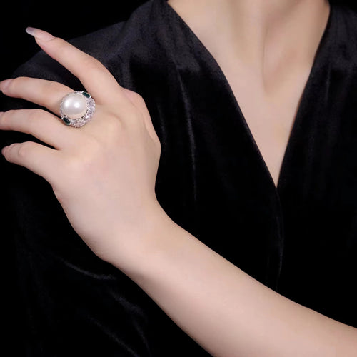 lady wearing Engagement ring with pearl and cubic zirconia