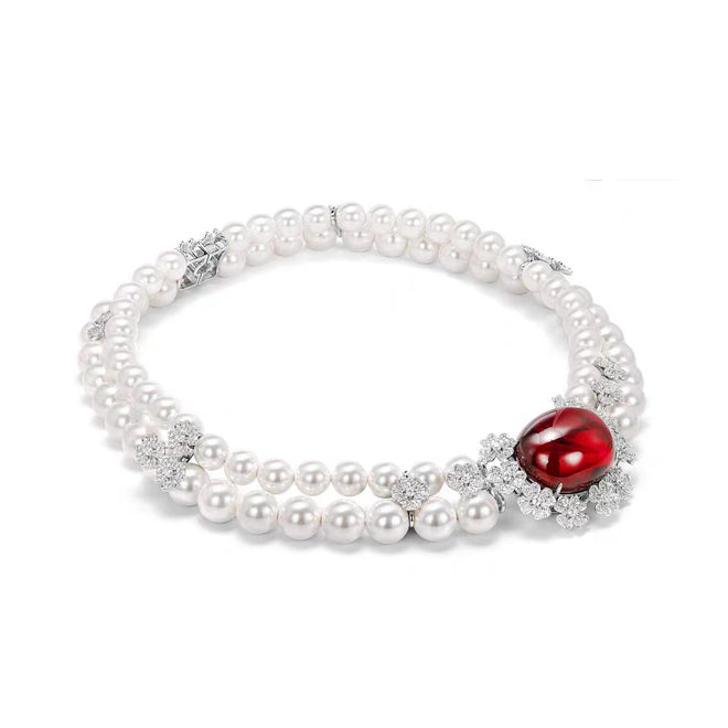 side view of Red cabuchon zirconia necklace with pearl