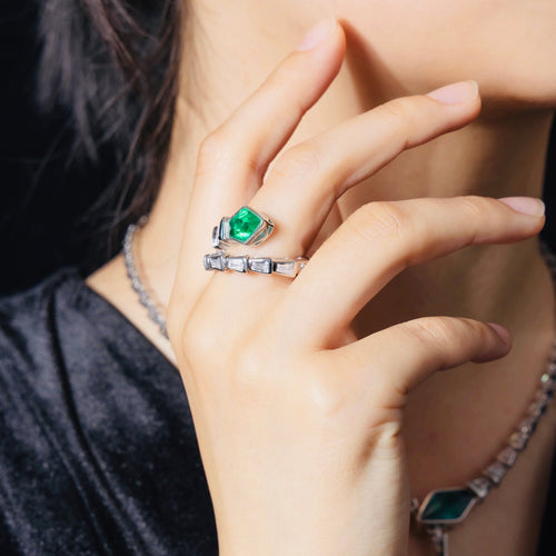 lady wearing Snake engagement ring with created emerald In silver