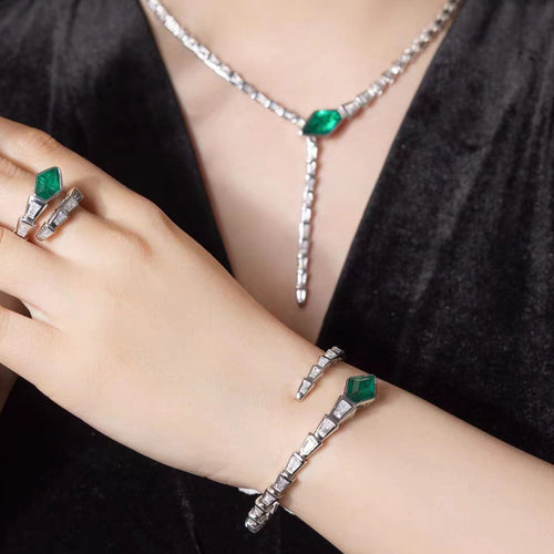 lady wearing Snake bangle with created emerald In silver