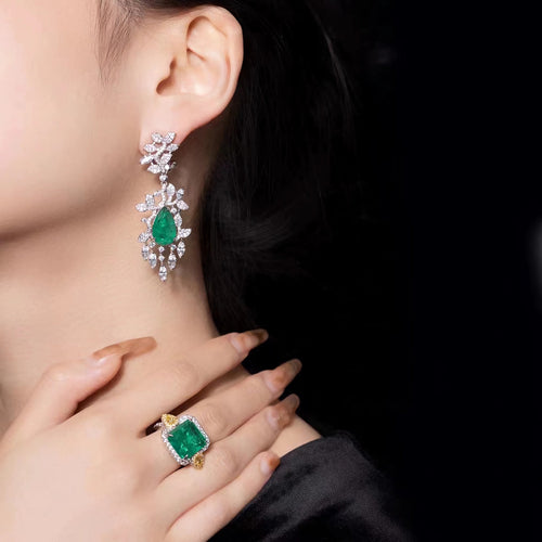 lady wearing Green cubic zirconia drop earrings in silver