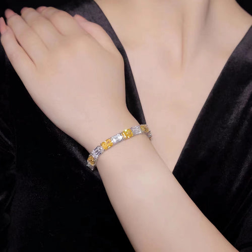 lady wearing Alternating yellow and blue zircon silver bracelet