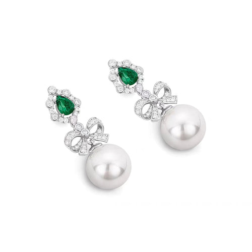 side view of Created pearl drop earrings with emerald in silver