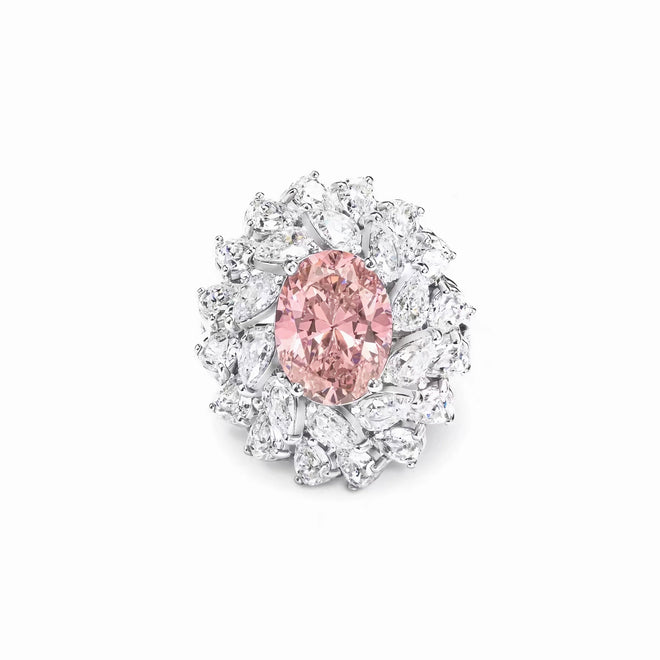 Oval pink zircon engagement ring with pear halo