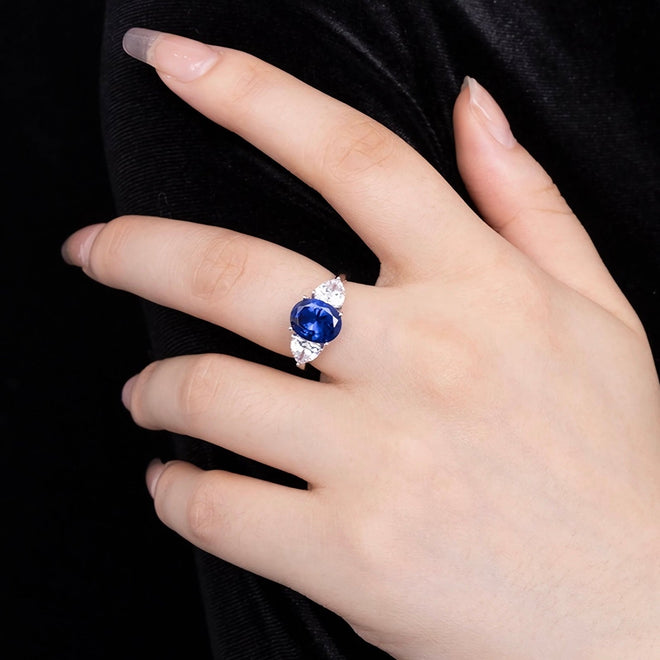 lady wearing Created blue sapphire ring with moissanites