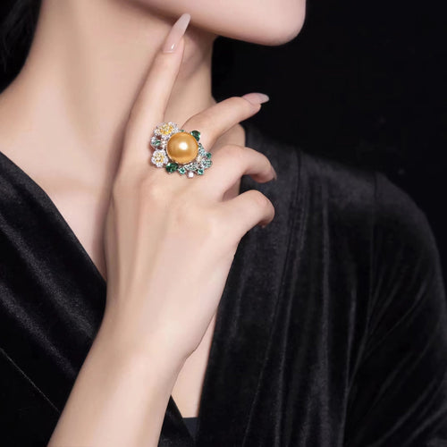 lady wearing Yellow pearl cocktail engagement ring in silver