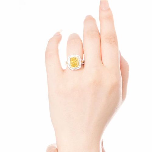 lady wearing Radiant yellow zircon halo cocktail ring in silver