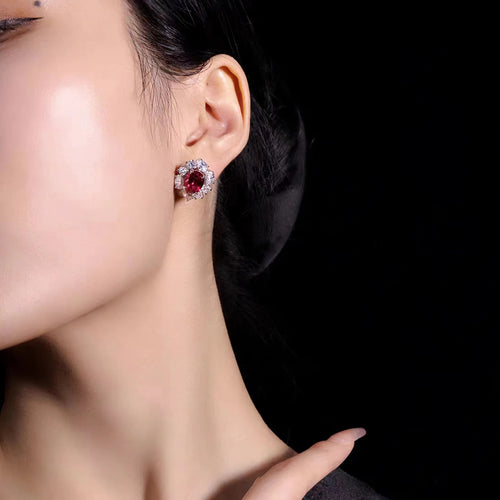 lady wearing Red oval zircon silver earrings with halo