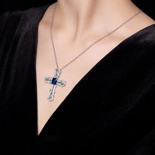 lady wearing Blue zircon cross necklace 