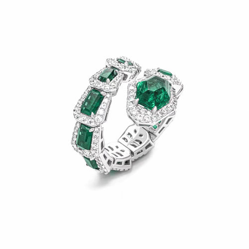 Green zircon ring in snake design