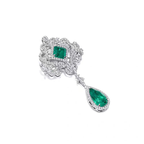 side view of Emerald brooch with moissanite in silver