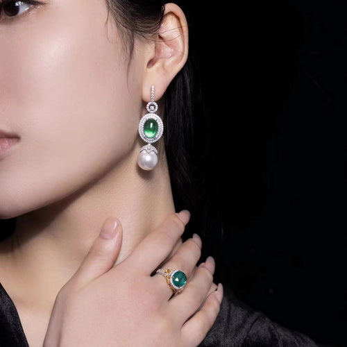 Pearl drop earrings with green cabuchon zircons