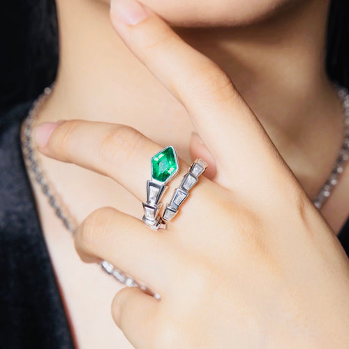 lady wearing Snake engagement ring with created emerald In silver