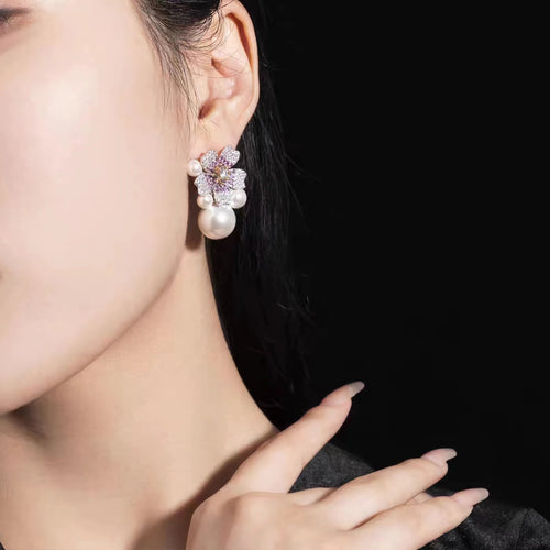 lady wearing Silver floral pearl earrings with moissanites