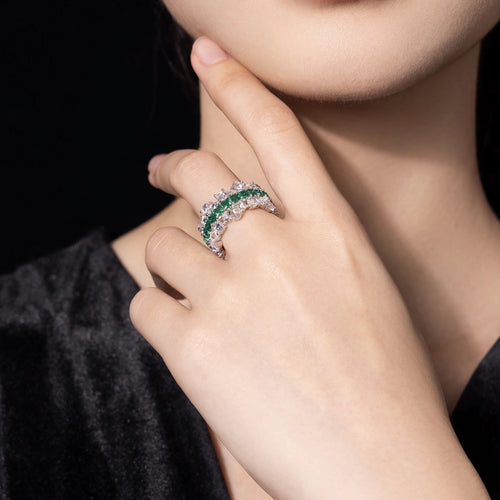 lady wearing Emerald wedding ring with moissanite in silver, eternity band