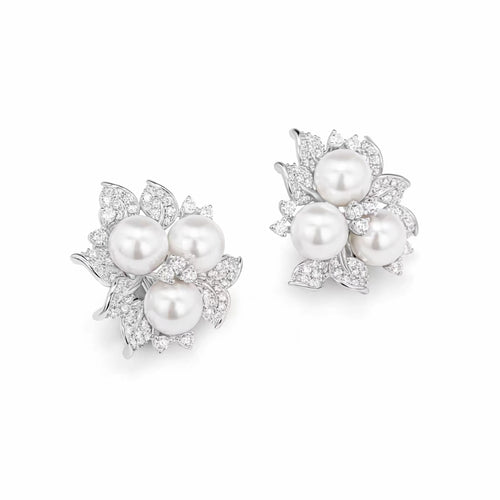 side view of Pearl silver earrings with moissanites 