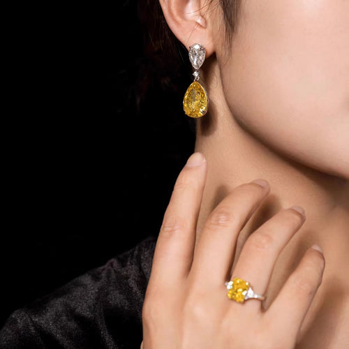 lady wearing Yellow pear zircon drop earrings