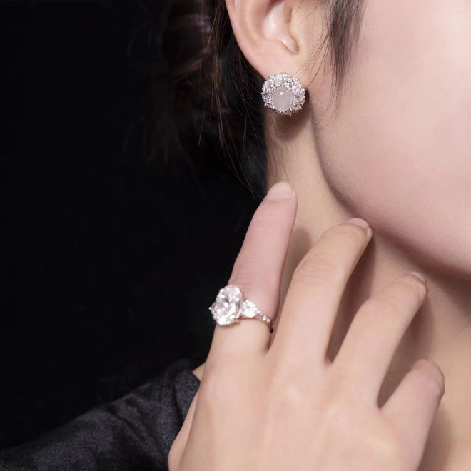 White cabuchon zircon earrings with halo