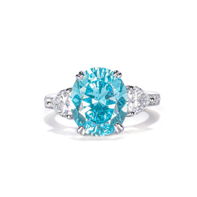 front view of Blue cubic zirconia engagement ring with side moissanites 