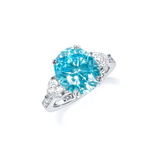 side view of Blue cubic zirconia engagement ring with side moissanites 