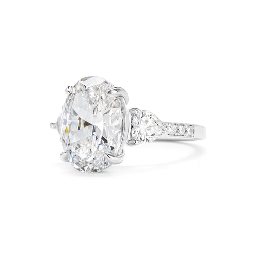 side view of Three stone oval cubic zirconia engagement ring in silver