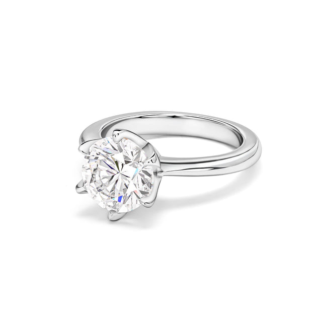 side view of Round halo solitaire engagement ring in silver