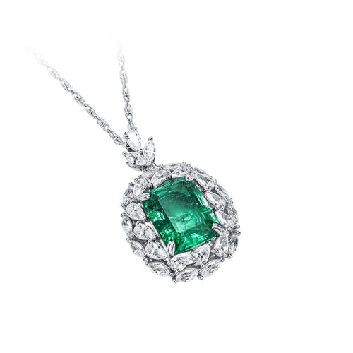 side view of Emerald necklace with moissanite halo in silver