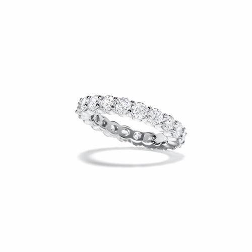 side view of Round moissanite full eternity wedding band in silver