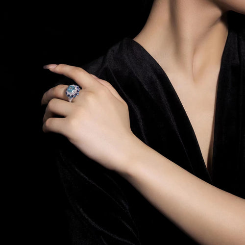 lady  wearing Blue zircon fancy silver statement ring  