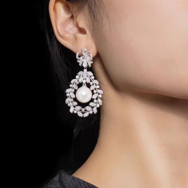 lady wearing Pearl drop earrings in floral design