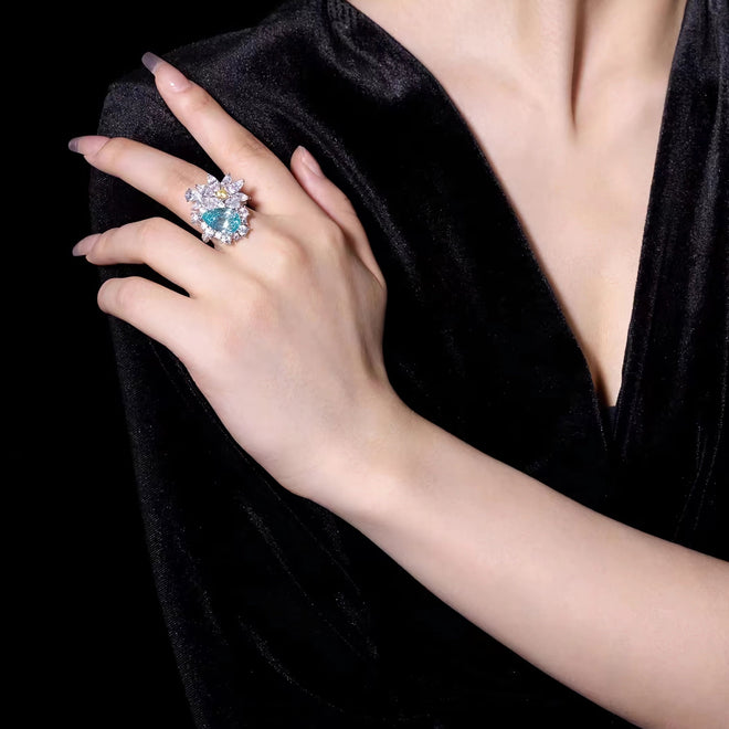 lady wearing Paraiba blue cubic zirconia cocktail ring in silver