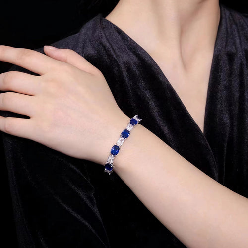 lady wearing Alternating blue and white zircon silver bracelet